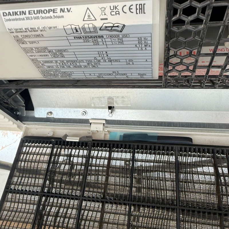 HVAC repair in progress with the system opened to show the inside